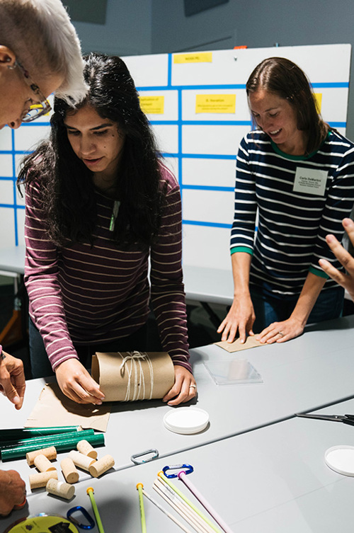 Educators participating in a building activity.