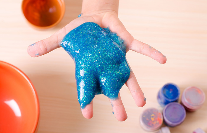 Child playing with slime.