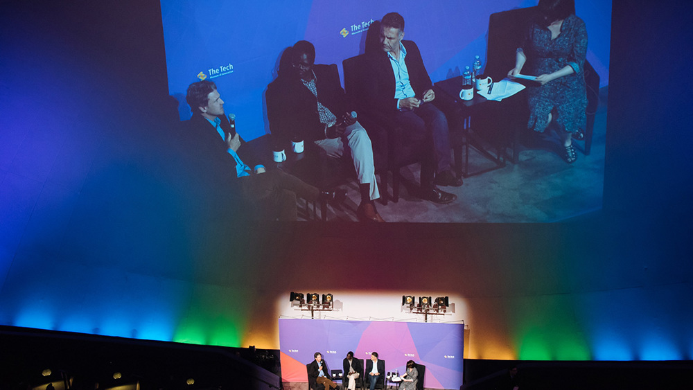 A panel discussion taking place in the IMAX Dome Theater.