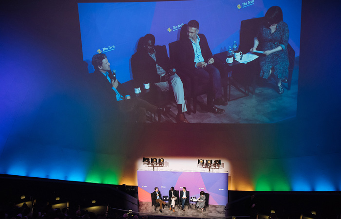 A panel discussion taking place in the IMAX Dome Theater.