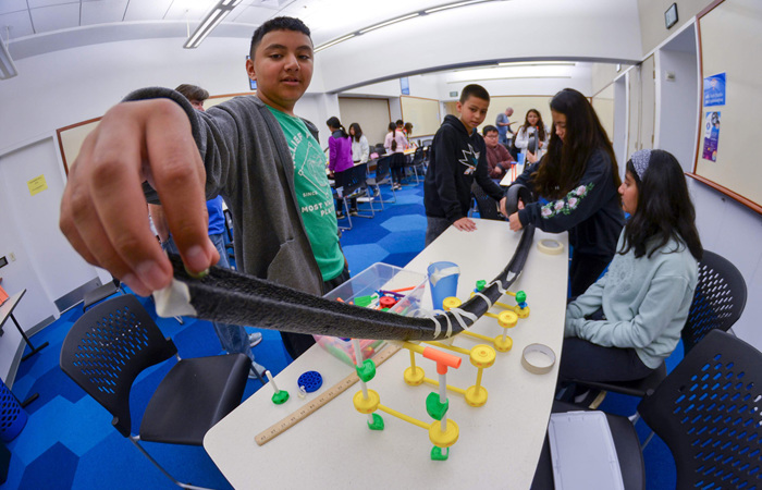 Visitors participating in a roller coaster lab.